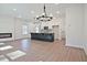 Open-concept living room and kitchen with modern finishes and ample natural light at 685 Sunstone Ln, Lawrenceville, GA 30043