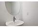 Modern bathroom features a sleek sink, black faucet and large mirror at 699 Sunstone Ln, Lawrenceville, GA 30043