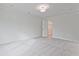 Bedroom with neutral carpet, white walls, ceiling light, and an open closet at 699 Sunstone Ln, Lawrenceville, GA 30043