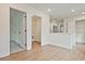 Hallway with views into an accessible storage area, closet, and carpeted bedroom at 699 Sunstone Ln, Lawrenceville, GA 30043