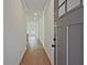 Inviting hallway with hardwood floors leading to the kitchen and main living area at 699 Sunstone Ln, Lawrenceville, GA 30043