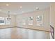 Open-concept living space with hardwood floors, recessed lighting, and lots of natural light at 699 Sunstone Ln, Lawrenceville, GA 30043