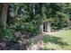 Backyard retreat featuring a charming garden bench, a rock path and a covered pergola at 351 Prestbury Ct, Suwanee, GA 30024