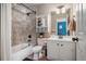 Bathroom featuring bathtub with tiled wall, single vanity and a framed mirror at 351 Prestbury Ct, Suwanee, GA 30024