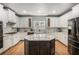 Beautiful kitchen with granite countertops, a central island, and modern appliances at 351 Prestbury Ct, Suwanee, GA 30024