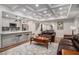 Open-concept living area with seating, kitchen, and game room showcasing the home's layout at 351 Prestbury Ct, Suwanee, GA 30024