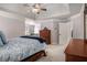 Open main bedroom with trey ceilings, adjoining sitting room, and coordinated furnishings at 351 Prestbury Ct, Suwanee, GA 30024