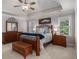 Large main bedroom featuring a trey ceiling, ceiling fan and coordinating bedroom furnishings at 351 Prestbury Ct, Suwanee, GA 30024