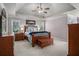 Spacious main bedroom with trey ceiling, plenty of natural light, and coordinating furnishings at 351 Prestbury Ct, Suwanee, GA 30024