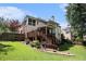 Wonderful home with a large backyard, a private deck, screened porch, and lush landscaping at 351 Prestbury Ct, Suwanee, GA 30024