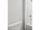 All-white bathroom featuring shower and toilet at 3623 Squires Park Ln, Loganville, GA 30052
