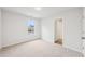 Bright bedroom with window view and neutral carpeting at 3623 Squires Park Ln, Loganville, GA 30052