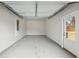 Two car garage has concrete floors, overhead lighting and ample storage at 3623 Squires Park Ln, Loganville, GA 30052