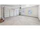 Spacious two car garage features overhead lighting, and an automatic door opener at 3623 Squires Park Ln, Loganville, GA 30052