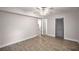An expansive bedroom featuring a ceiling fan and light-colored walls is enhanced by the natural-toned wood flooring at 6176 Hyde Park Ln, Lithonia, GA 30058