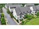 Aerial view of townhomes with manicured landscaping and street frontage at 6399 Lucent Ln, Atlanta, GA 30328