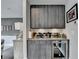 This home features a stylish bar area with a wine fridge, cabinetry, and modern accents for entertaining at 6399 Lucent Ln, Atlanta, GA 30328