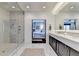 Primary bathroom with double vanity, glass shower, and views into the main bedroom at 6399 Lucent Ln, Atlanta, GA 30328