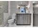 Modern bathroom featuring a gray vanity, tiled shower, and stylish fixtures at 6399 Lucent Ln, Atlanta, GA 30328