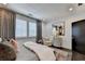 Bright bedroom showcasing window shutters, elegant furnishings, and a cozy armchair at 6399 Lucent Ln, Atlanta, GA 30328