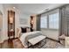 Beautifully decorated bedroom with a comfortable bed, stylish lighting, and elegant window shutters at 6399 Lucent Ln, Atlanta, GA 30328