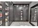 Walk in closet with custom cabinets and glass doors providing an abundance of storage space at 6399 Lucent Ln, Atlanta, GA 30328