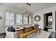 Elegant dining room with a rustic wooden table, bench seating, and modern chandelier at 6399 Lucent Ln, Atlanta, GA 30328