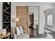 Dark wood floors and a unique barn door are the highlights of this foyer at 6399 Lucent Ln, Atlanta, GA 30328