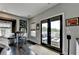 Hallway with windows, seating, and access to outdoor lounge area, combining indoor comfort with outdoor leisure at 6399 Lucent Ln, Atlanta, GA 30328
