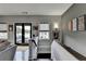The hallway has a lounge area and patio door with a serene outdoor view, connecting indoor and outdoor spaces at 6399 Lucent Ln, Atlanta, GA 30328