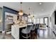 Open-concept kitchen with a marble countertop island, stainless steel appliances, and modern cabinetry at 6399 Lucent Ln, Atlanta, GA 30328