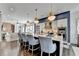 Kitchen island with seating provides a perfect view of the open living area, complemented by stainless steel appliances at 6399 Lucent Ln, Atlanta, GA 30328
