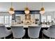 Gourmet kitchen features a large island, stainless steel appliances, and stylish pendant lighting at 6399 Lucent Ln, Atlanta, GA 30328