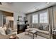 Modern living room with comfortable sofa and armchair, stylish decor, and a convenient wet bar area at 6399 Lucent Ln, Atlanta, GA 30328