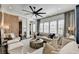 A large seating area, modern decor, a decorative barn door, and bright natural light are featured in this living room at 6399 Lucent Ln, Atlanta, GA 30328