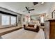 Spacious main bedroom with a seating area, decorative mirror, and large windows with shutters at 6399 Lucent Ln, Atlanta, GA 30328