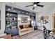 The office has a beautiful built-in blue cabinet with shelving, decor, and lighting for a cozy and modern work environment at 6399 Lucent Ln, Atlanta, GA 30328