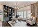 This home office features a large custom bookcase, stylish light fixture and lots of natural light at 6399 Lucent Ln, Atlanta, GA 30328