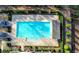 Aerial view of a sparkling community pool with lounge area and lush landscaping at 6399 Lucent Ln, Atlanta, GA 30328