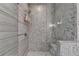 Luxurious walk-in shower with mosaic tile walls and a built-in bench at 6399 Lucent Ln, Atlanta, GA 30328