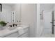 Bright bathroom featuring modern vanity, sleek fixtures, and patterned tile floor at 2214 Meador Ave Se, Atlanta, GA 30315