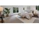Relaxing bedroom with natural light, neutral colors, and bench at the end of the bed at 2214 Meador Ave Se, Atlanta, GA 30315