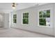 Bright, neutral bedroom with double-door closet and windows overlooking the greenery at 2214 Meador Ave Se, Atlanta, GA 30315