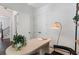 Contemporary home office features a stylish desk, modern lighting, and hardwood floors at 2214 Meador Ave Se, Atlanta, GA 30315