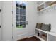 Mud room with built in shelving and storage next to back door entry at 2214 Meador Ave Se, Atlanta, GA 30315