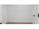 Spacious walk-in closet featuring upper shelving and neutral carpeting at 2214 Meador Ave Se, Atlanta, GA 30315