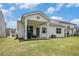 Spacious backyard features lush green grass, providing ample space for outdoor activities and enjoyment at 2304 Pelham Pass, Dacula, GA 30019