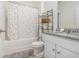 Cozy bathroom featuring a shower-tub combo and granite countertops, offering both functionality and style at 2304 Pelham Pass, Dacula, GA 30019