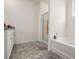 Bright bathroom features a soaking tub and glass-enclosed shower at 2304 Pelham Pass, Dacula, GA 30019