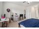 Bedroom features ceiling fan, desk, and closet at 2304 Pelham Pass, Dacula, GA 30019